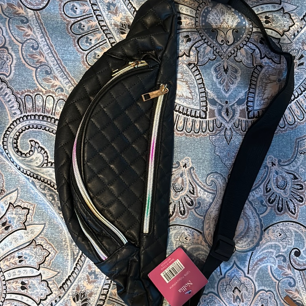 NWT Fanny pack with 3 zippered pockets. Never used.